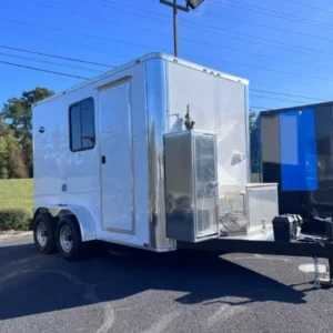 White Legacy Series 7x12 mobile pet grooming trailer with Flying Pig tub, K9 II dryer, electric grooming table, wall-mounted vacuum, and generator power.