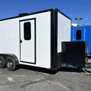White 7x14 tandem axle Genesis Series mobile pet grooming trailer with .080 Polycore exterior, blackout trim package, 50" Flying Pig grooming tub, and professional interior setup - Stock GS-68997