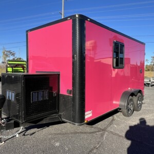 Pink Genesis Series 7x12 mobile pet grooming trailer with blackout trim, generator box, electric jack, mag wheels, and 75-gallon water tanks.