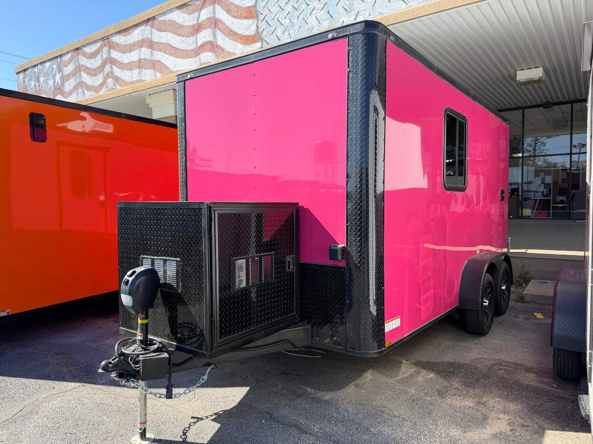 Pink Genesis Series 7x14 mobile pet grooming trailer with blackout trim, mag wheels, electric jack, generator box, and 75-gallon fresh water tank.