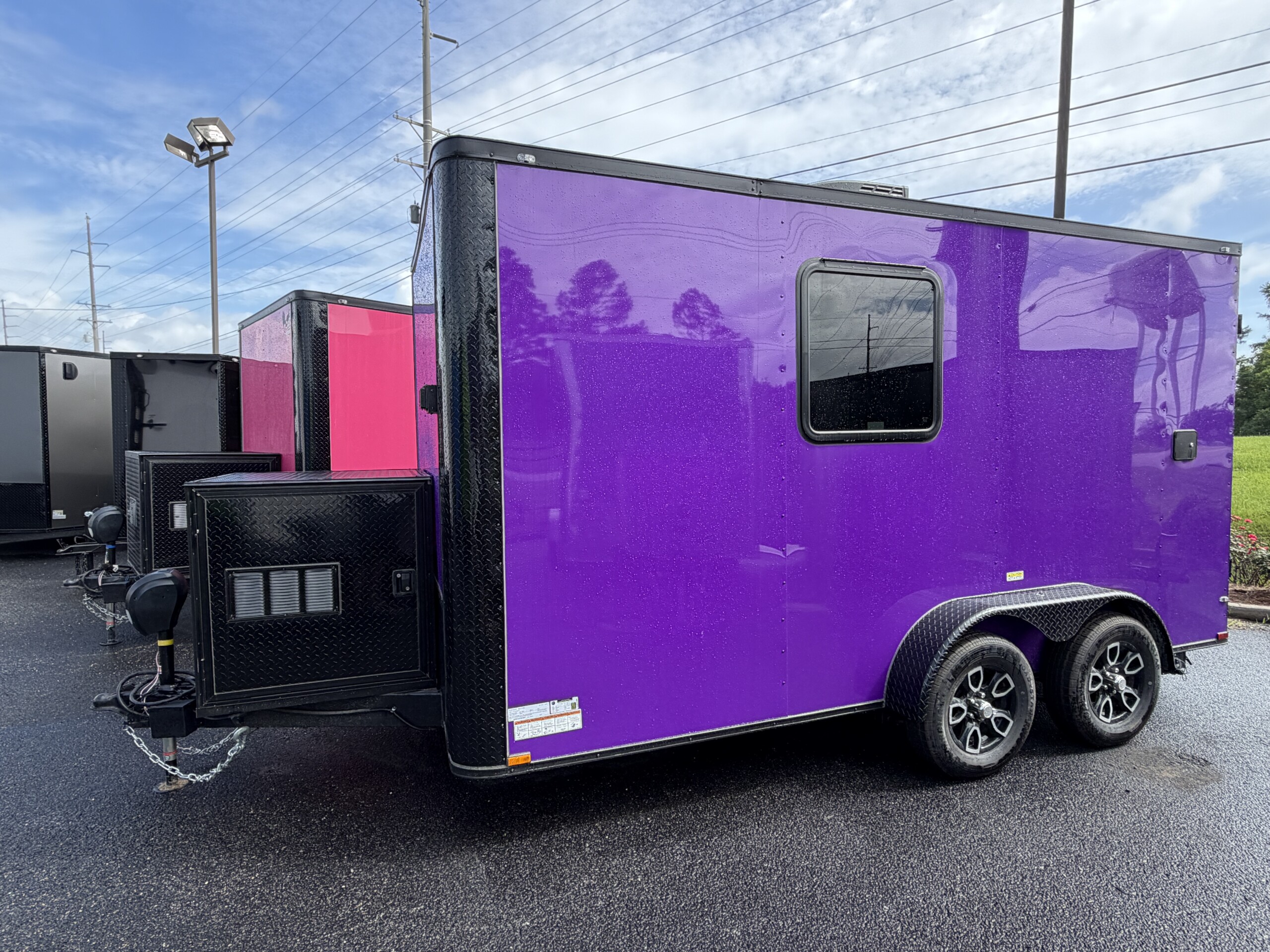 Purple Genesis Series 7x14 mobile pet grooming trailer with blackout trim, mag wheels, electric jack, generator box with slideout tray, and 75-gallon fresh water tank.