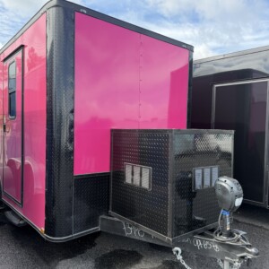 Pink 7x14 mobile pet grooming trailer with blackout package, mag wheels, electric jack, generator box, wood-look flooring, and 75-gallon water tanks.