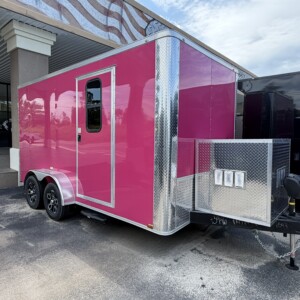 Pink Genesis Series 7x14 mobile pet grooming trailer featuring chrome trim, mag wheels, electric jack, generator box with slideout tray, and 75-gallon fresh water tank.