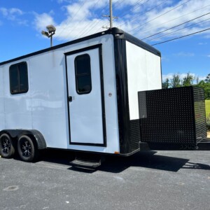 White 7x16 Quality Cargo pet grooming trailer with blackout package, Flying Pig tub, Hanvey HairVac, generator box, A/C, and water tanks.